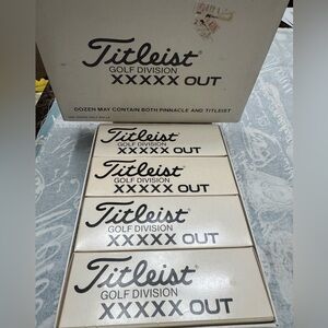 Titleist golf division xxxxx out gold balls, a dozen